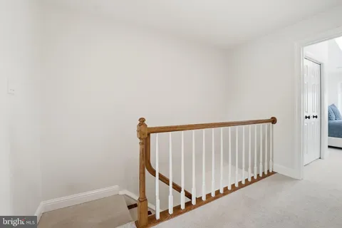 a bathroom with a sink mirror and vanity