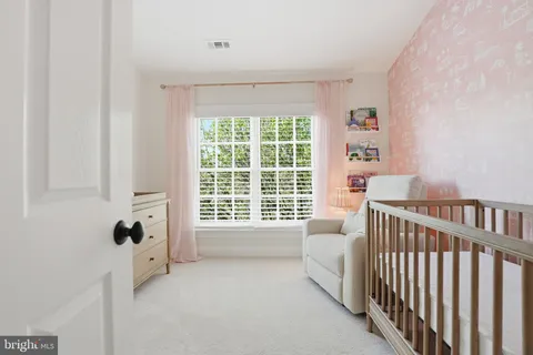 a pathway of a house with a yard