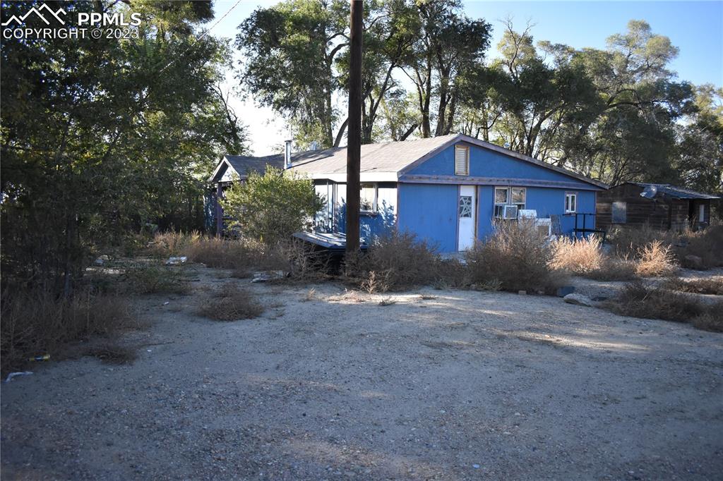 600 West 3rd Street Ordway, CO 81063 - Photo 13 of 25 a wooden fence with large trees