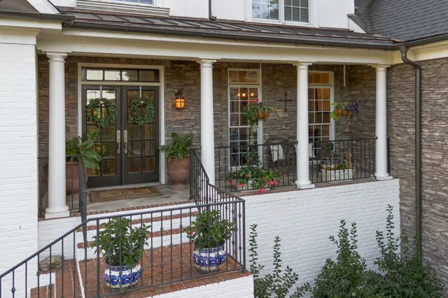 front view of a house with a potted plant