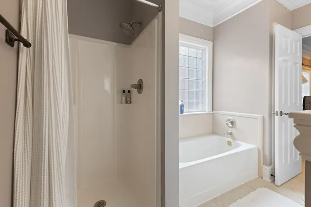 a view of a house with a backyard and sitting area