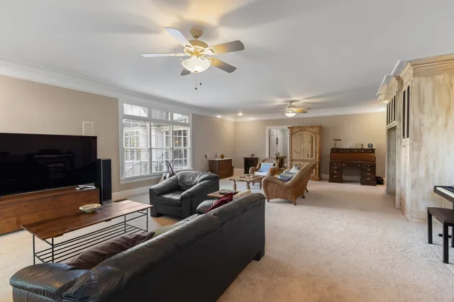a view of a house with backyard sitting area and garden