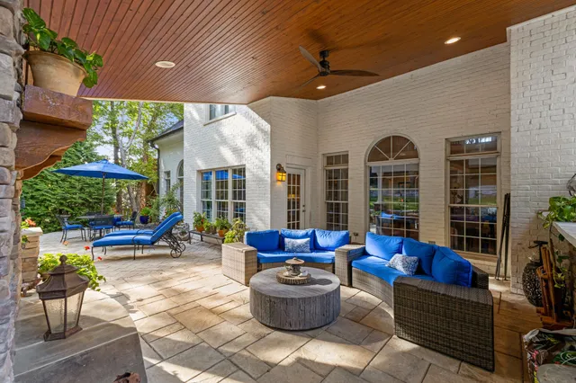 an aerial view of residential houses with outdoor space and trees