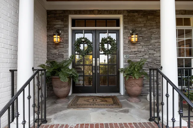 a front view of a house with a garden