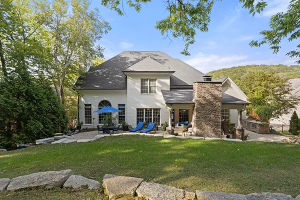 a view of an entryway with wooden floor and door
