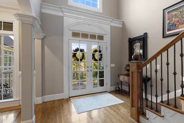 a view of entryway and hall with wooden floor
