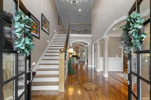 a bedroom with a bed and large mirror