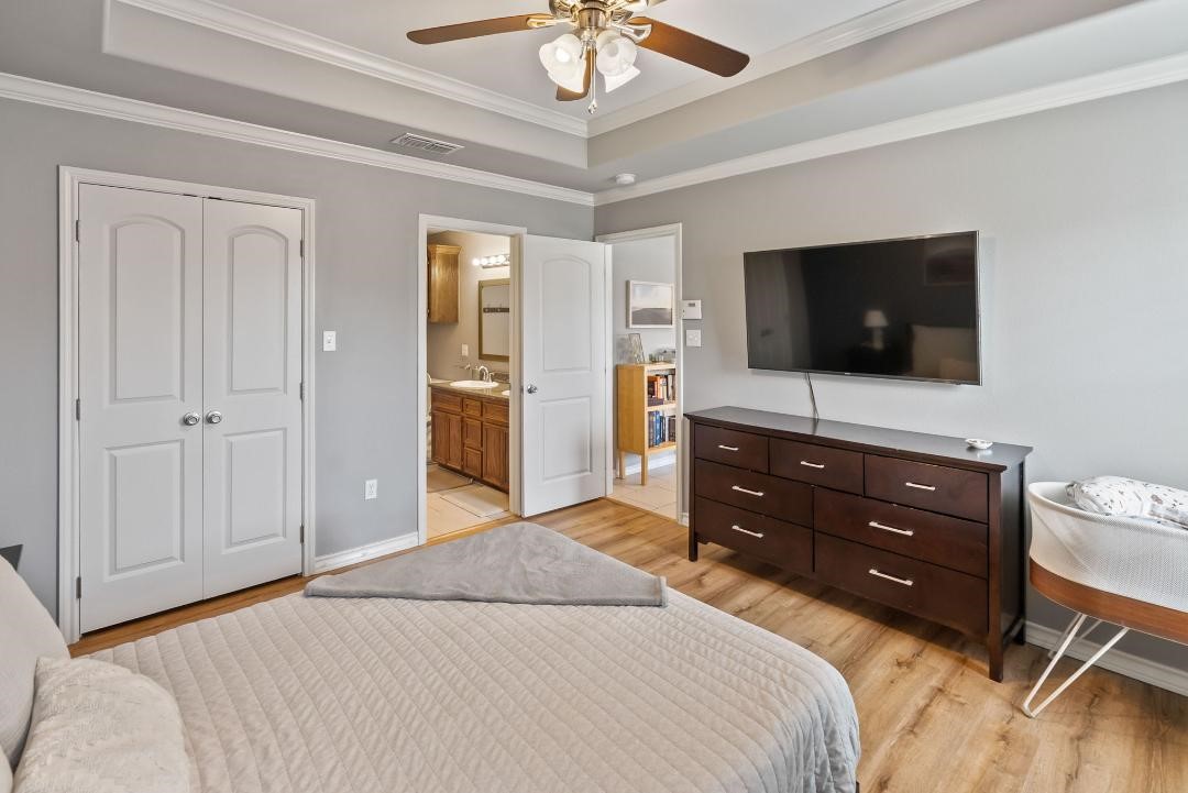 4328 Bratton Road Corpus Christi, TX 78413 - Photo 14 of 24 a bedroom with a bed and a flat screen tv