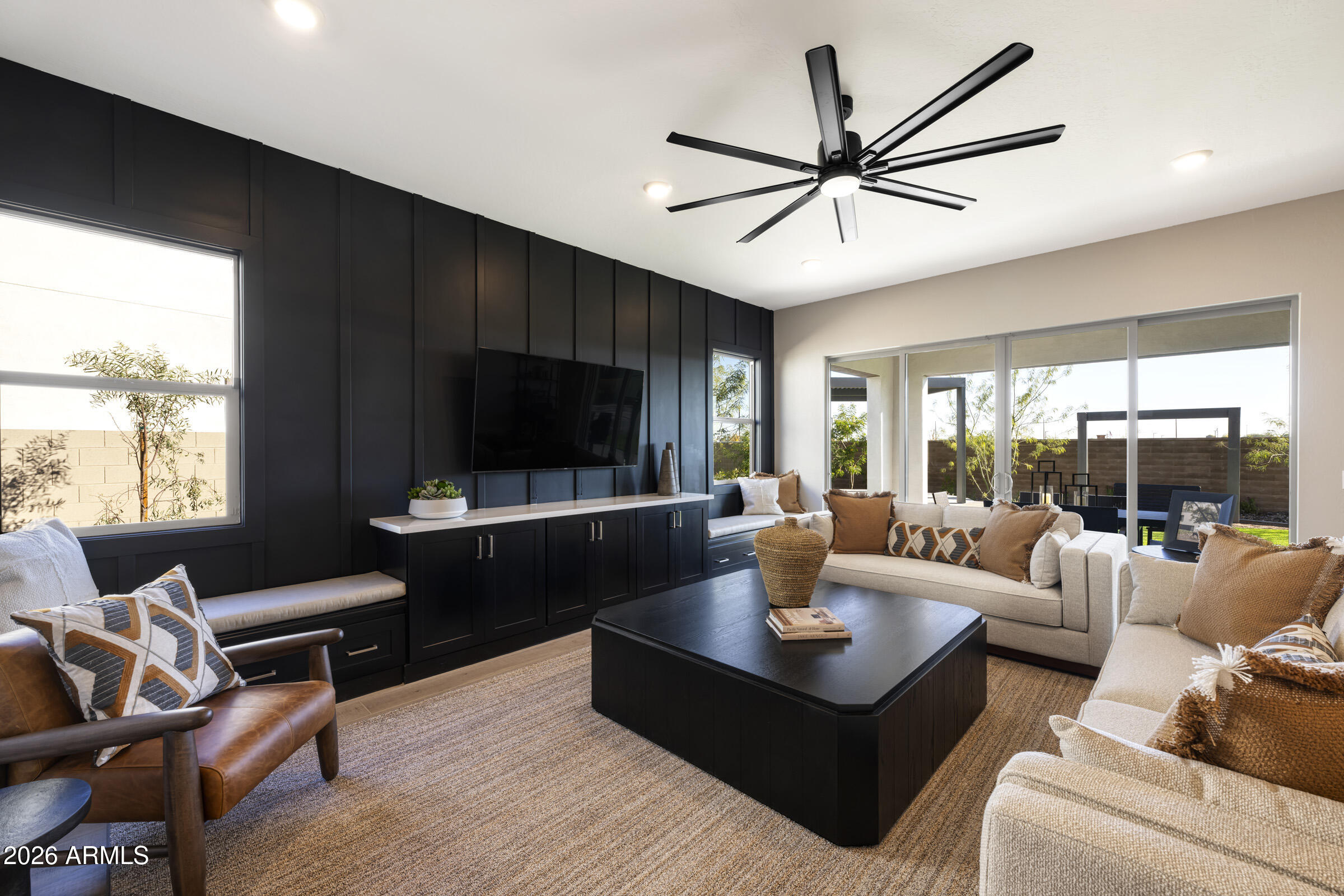 5737 South Quartz Street Gilbert, AZ 85298 - Photo 7 of 15 a living room with furniture a ceiling fan and a large window