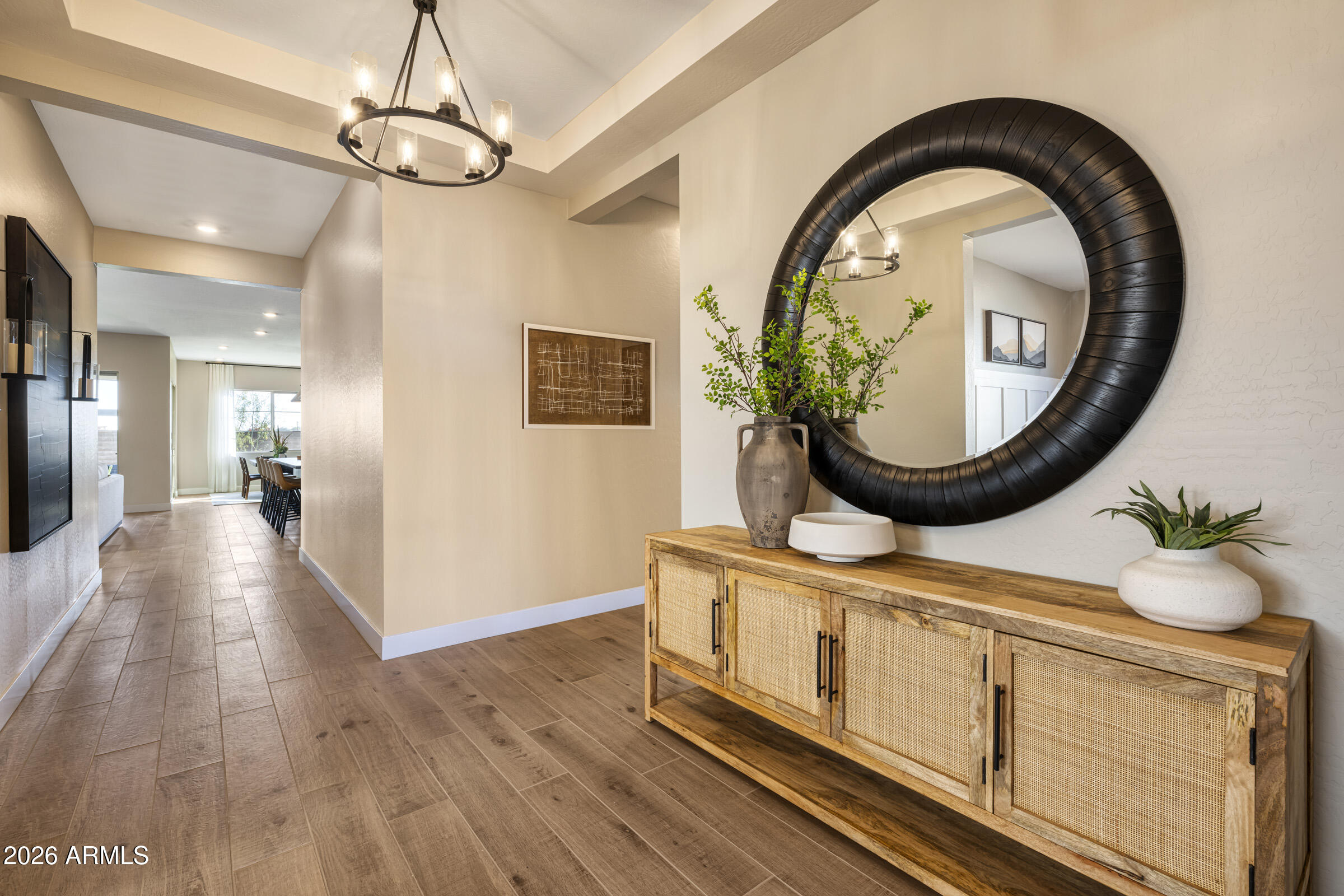 5737 South Quartz Street Gilbert, AZ 85298 - Photo 8 of 15 a view of a livingroom with furniture wooden floor and a mirror