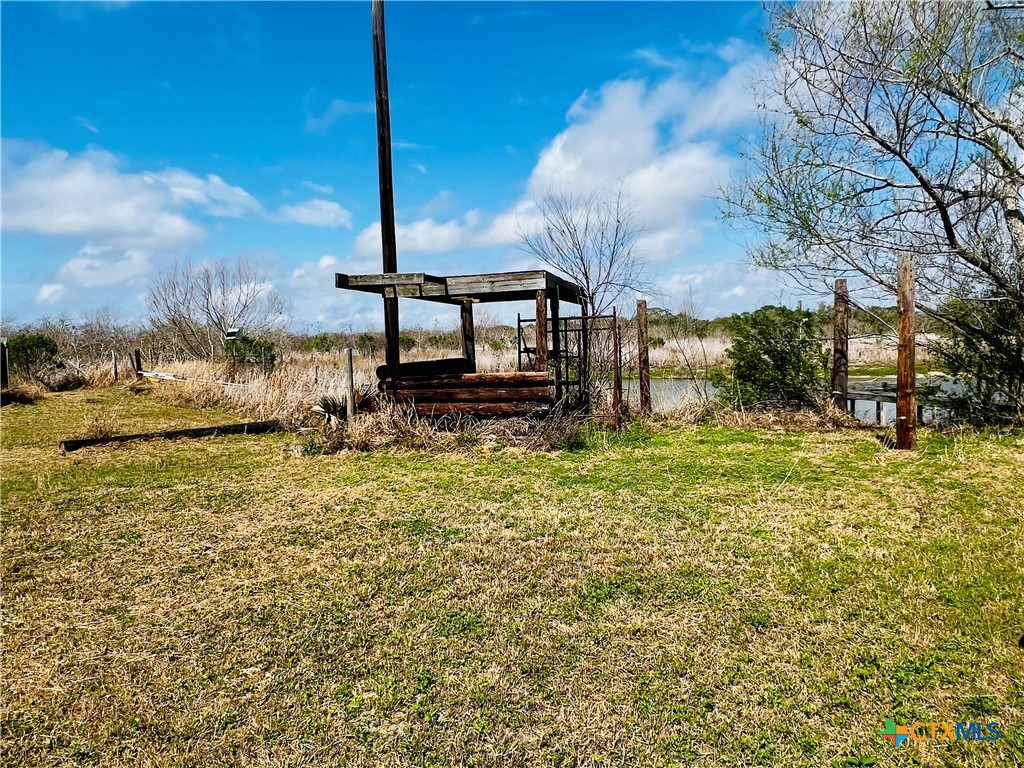607 Quail Meadow Road Seadrift, TX 77983 - Photo 15 of 48 a view of a backyard of the house