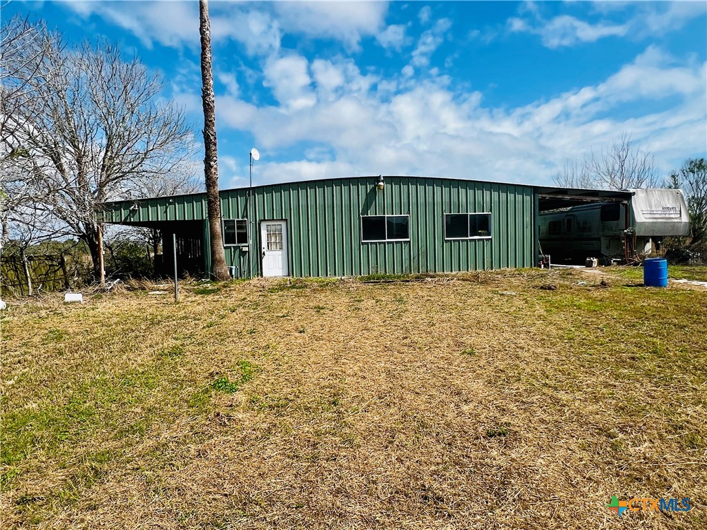 607 Quail Meadow Road Seadrift, TX 77983 - Photo 18 of 48 a view of a house with a wooden fence