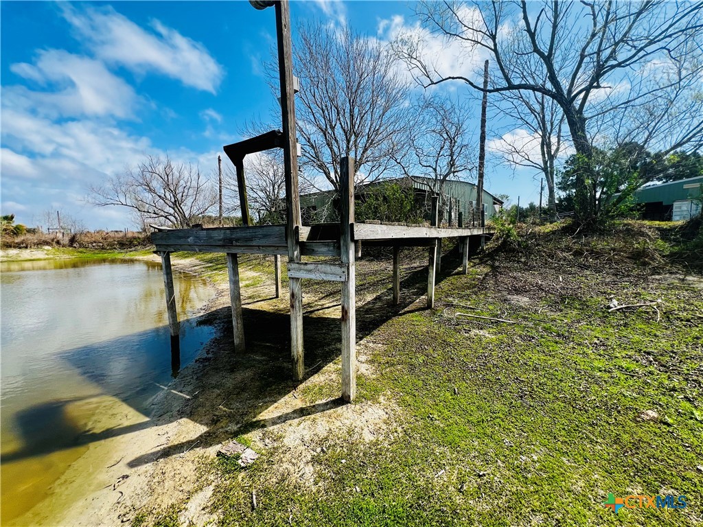 607 Quail Meadow Road Seadrift, TX 77983 - Photo 21 of 48 a view of a swimming pool with a patio