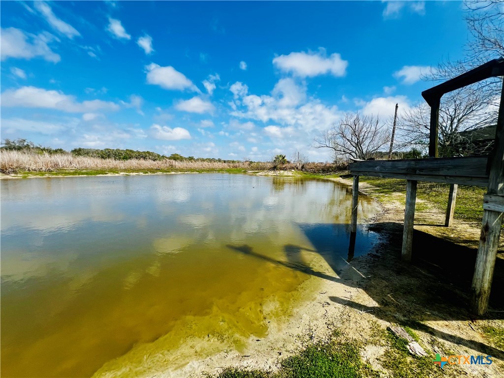 607 Quail Meadow Road Seadrift, TX 77983 - Photo 22 of 48 a view of a swimming pool with an outdoor seating