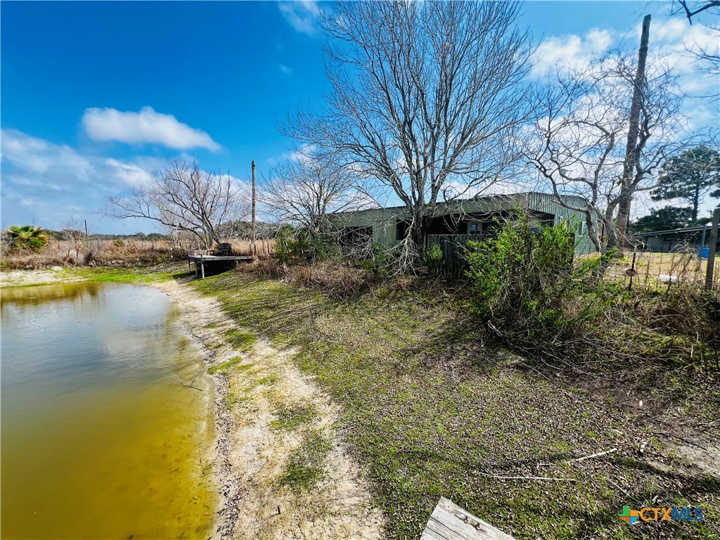 607 Quail Meadow Road Seadrift, TX 77983 - Photo 26 of 48 a view of a house with a yard
