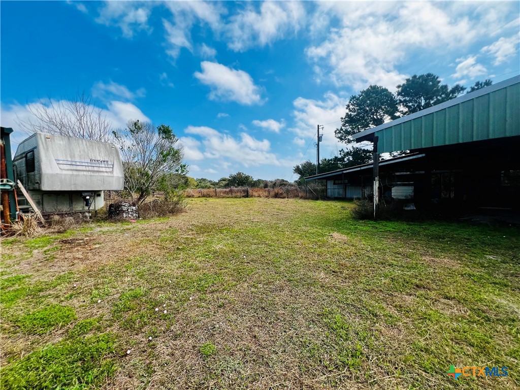 607 Quail Meadow Road Seadrift, TX 77983 - Photo 33 of 48 a view of a terrace with a garden