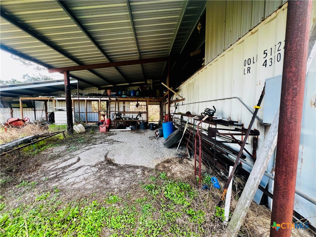 607 Quail Meadow Road Seadrift, TX 77983 - Photo 34 of 48 a view of a garage with a table and chairs