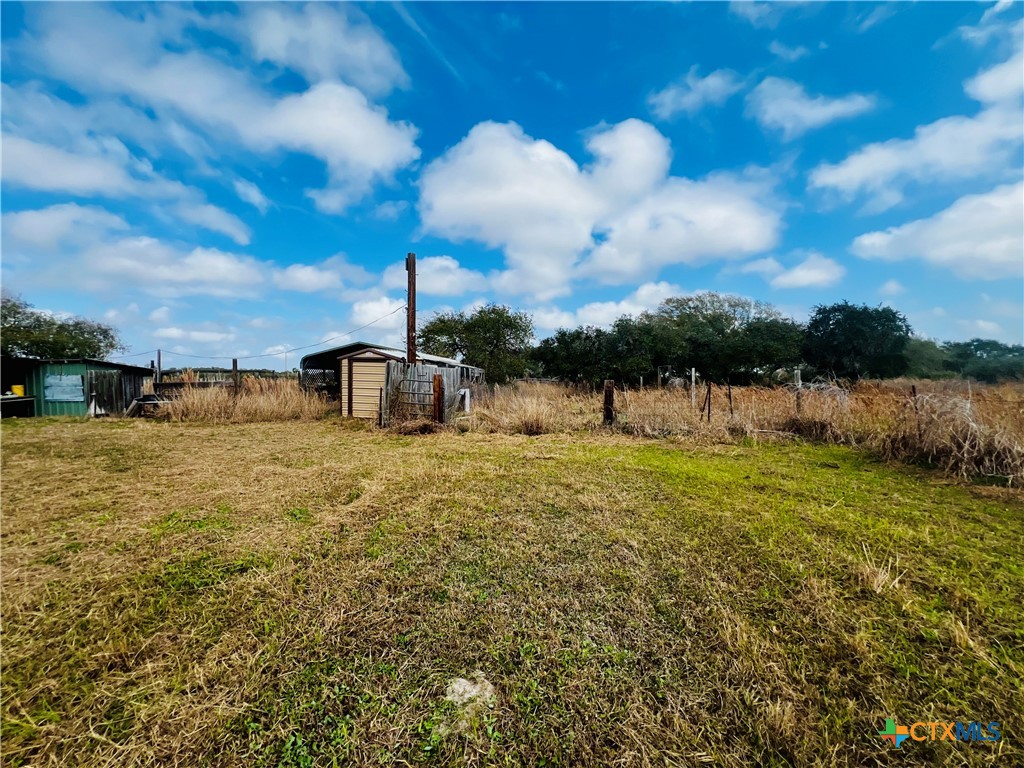 607 Quail Meadow Road Seadrift, TX 77983 - Photo 41 of 48 a view of a lake with a big yard