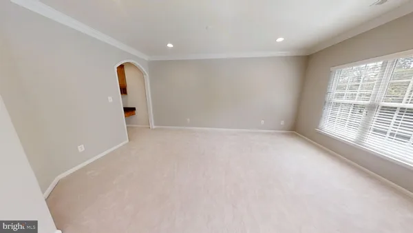 a white toilet sitting next to a bath tub