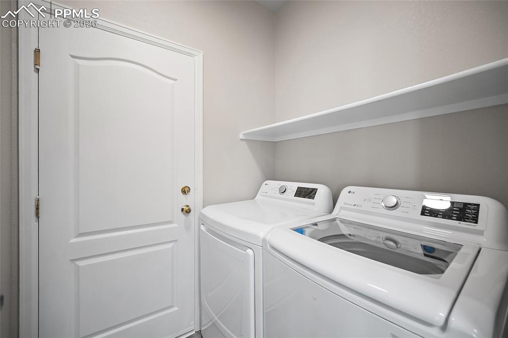 855 Dawn Break Loop Colorado Springs, CO 80910 - Photo 17 of 42 a utility room with dryer and washer