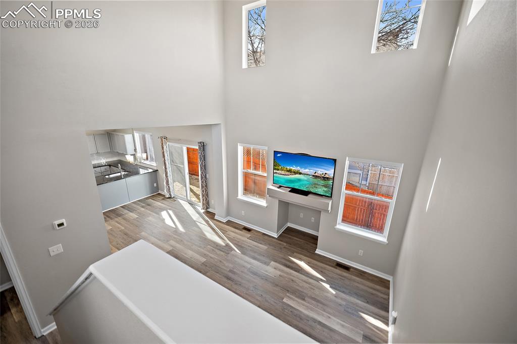 855 Dawn Break Loop Colorado Springs, CO 80910 - Photo 20 of 42 a living room with furniture and a flat screen tv