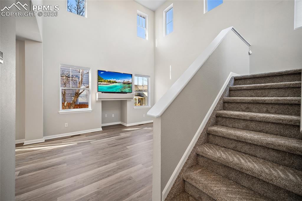 855 Dawn Break Loop Colorado Springs, CO 80910 - Photo 4 of 42 a view of a hallway with wooden floor and entryway