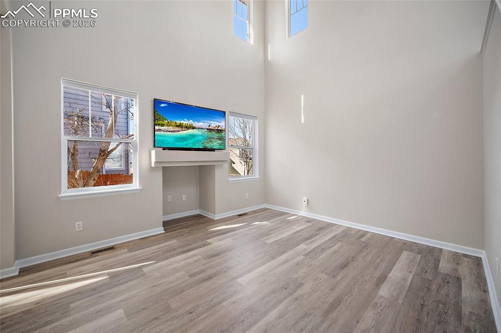 855 Dawn Break Loop Colorado Springs, CO 80910 - Photo 7 of 42 a view of a room with wooden floor and window