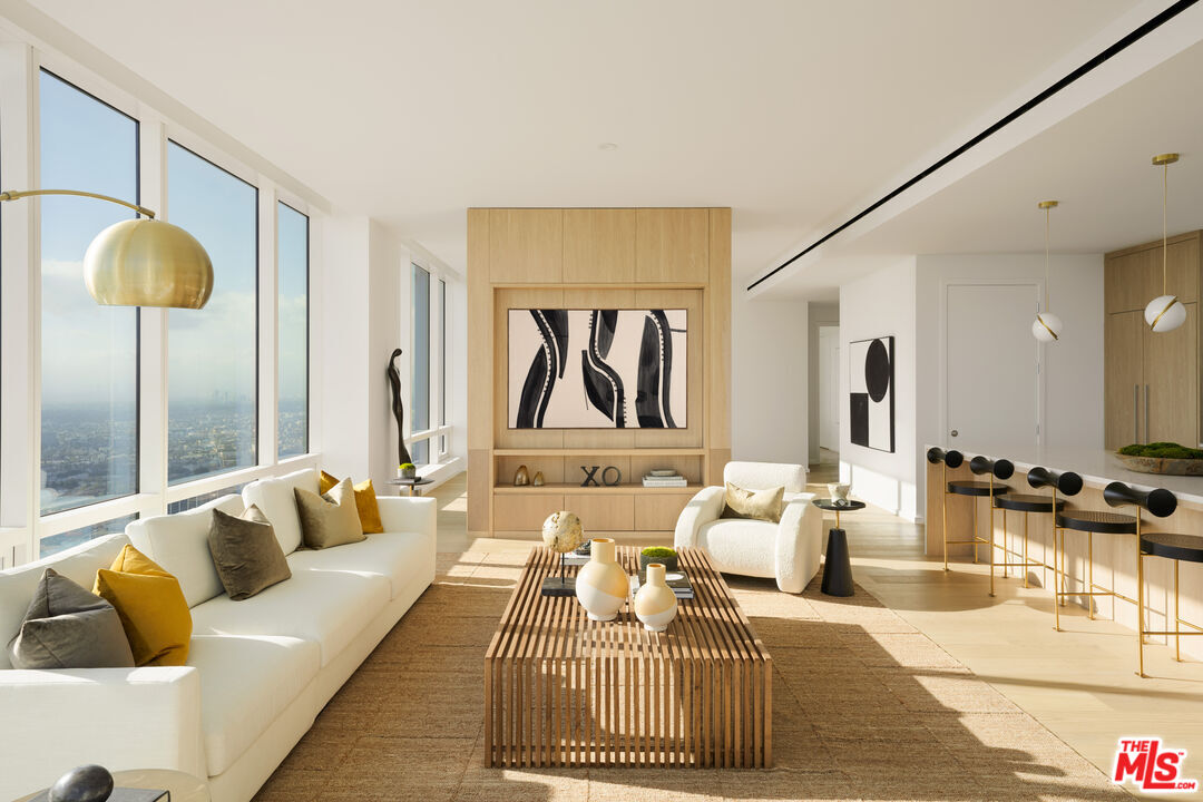 1000 West 8th Street, Unit PH5803 Los Angeles, CA 90017 - Photo 2 of 57 a living room with furniture and a lamp