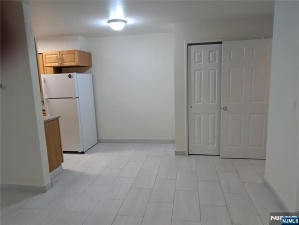 a kitchen with stainless steel appliances granite countertop a stove sink and microwave