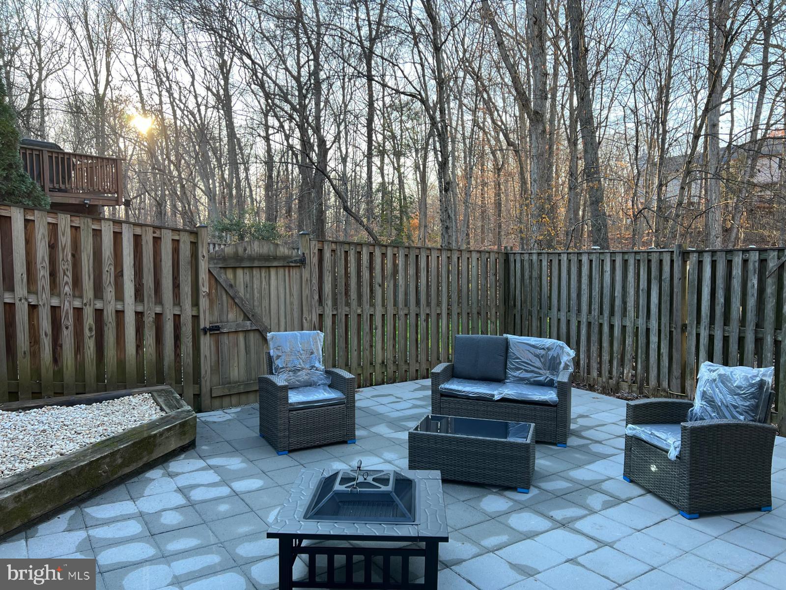 7408 Spring Tree Drive Springfield, VA 22153 - Photo 3 of 3 Serene patio retreat at sunset.