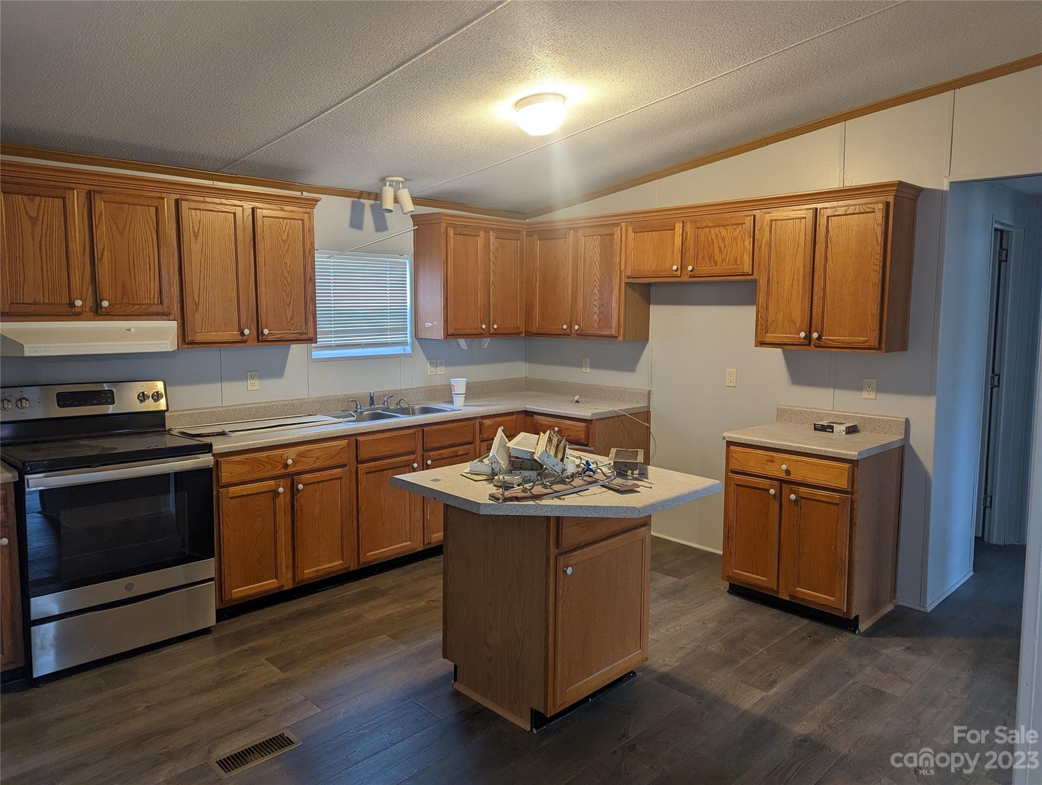4261 Henry Dellinger Road Maiden, NC 28650 - Photo 3 of 5 a kitchen with stainless steel appliances granite countertop a stove a sink dishwasher and a refrigerator
