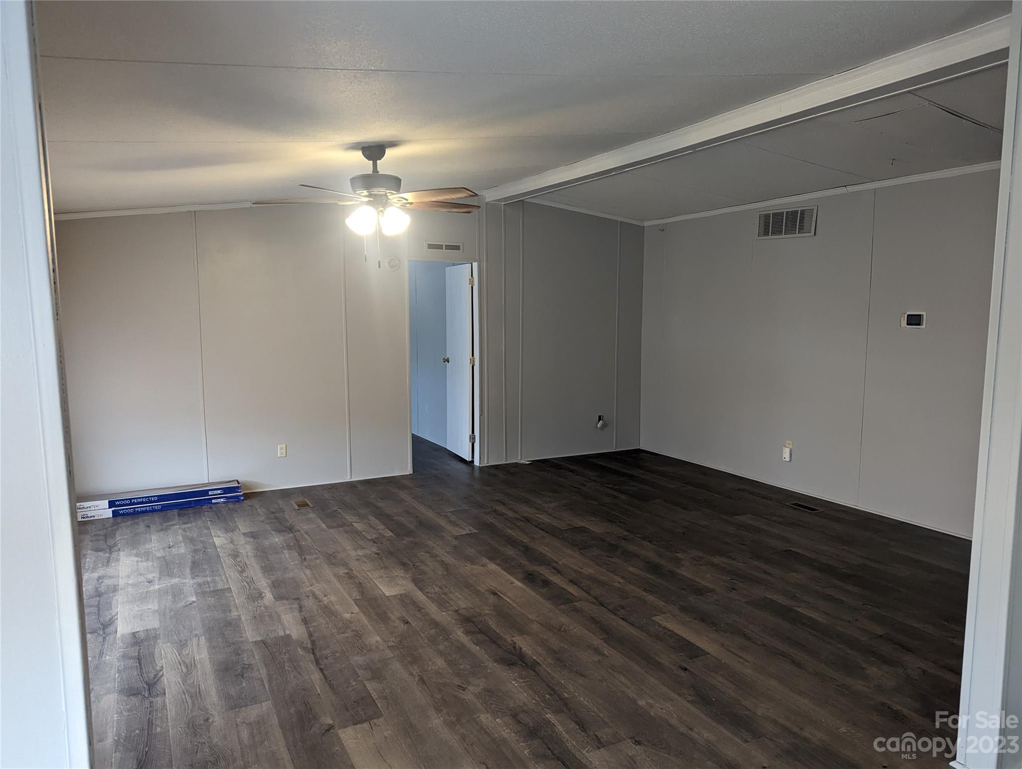 4261 Henry Dellinger Road Maiden, NC 28650 - Photo 5 of 5 a view of an empty room with a ceiling fan and window