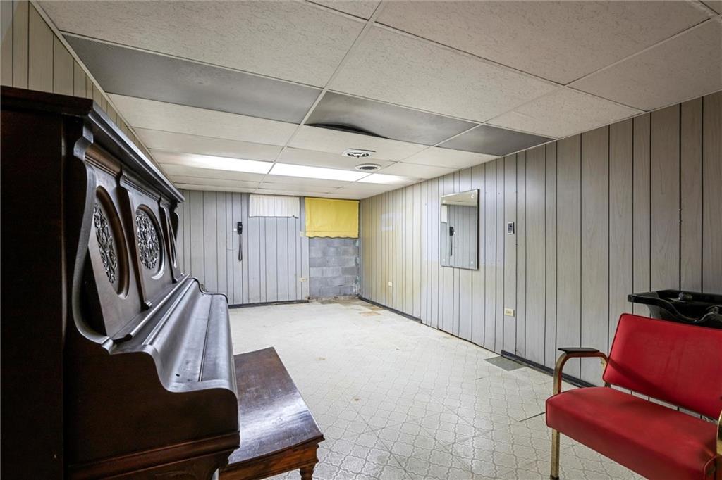 8324 Lamor Road Mercer, PA 16137 - Photo 17 of 30 a view of an empty room with wooden floor and furniture