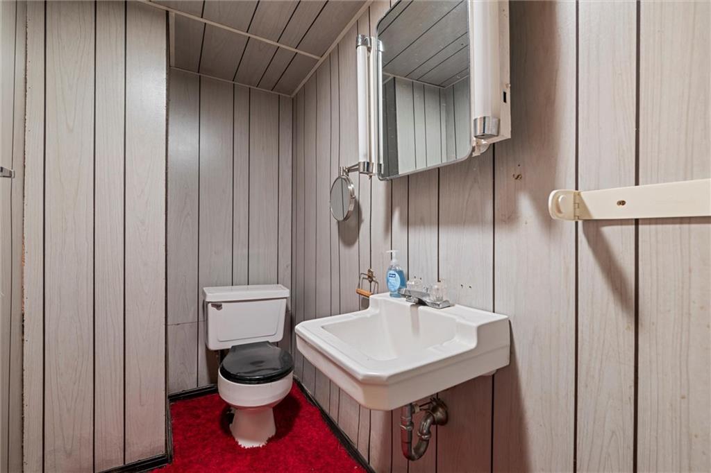 8324 Lamor Road Mercer, PA 16137 - Photo 18 of 30 a bathroom with a sink a toilet and a mirror