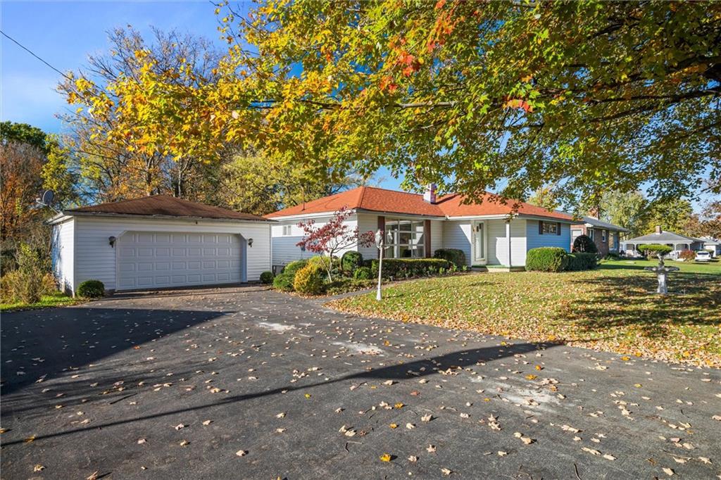 8324 Lamor Road Mercer, PA 16137 - Photo 25 of 30 a front view of a house with a yard and garage