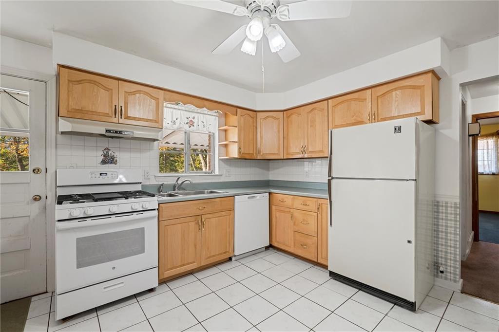 8324 Lamor Road Mercer, PA 16137 - Photo 5 of 30 a kitchen with cabinets stainless steel appliances and a window