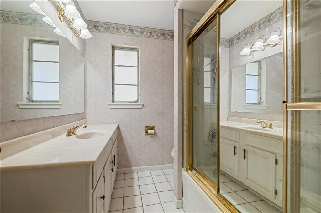 8324 Lamor Road Mercer, PA 16137 - Photo 10 of 30 a bathroom with a tub sink and mirror