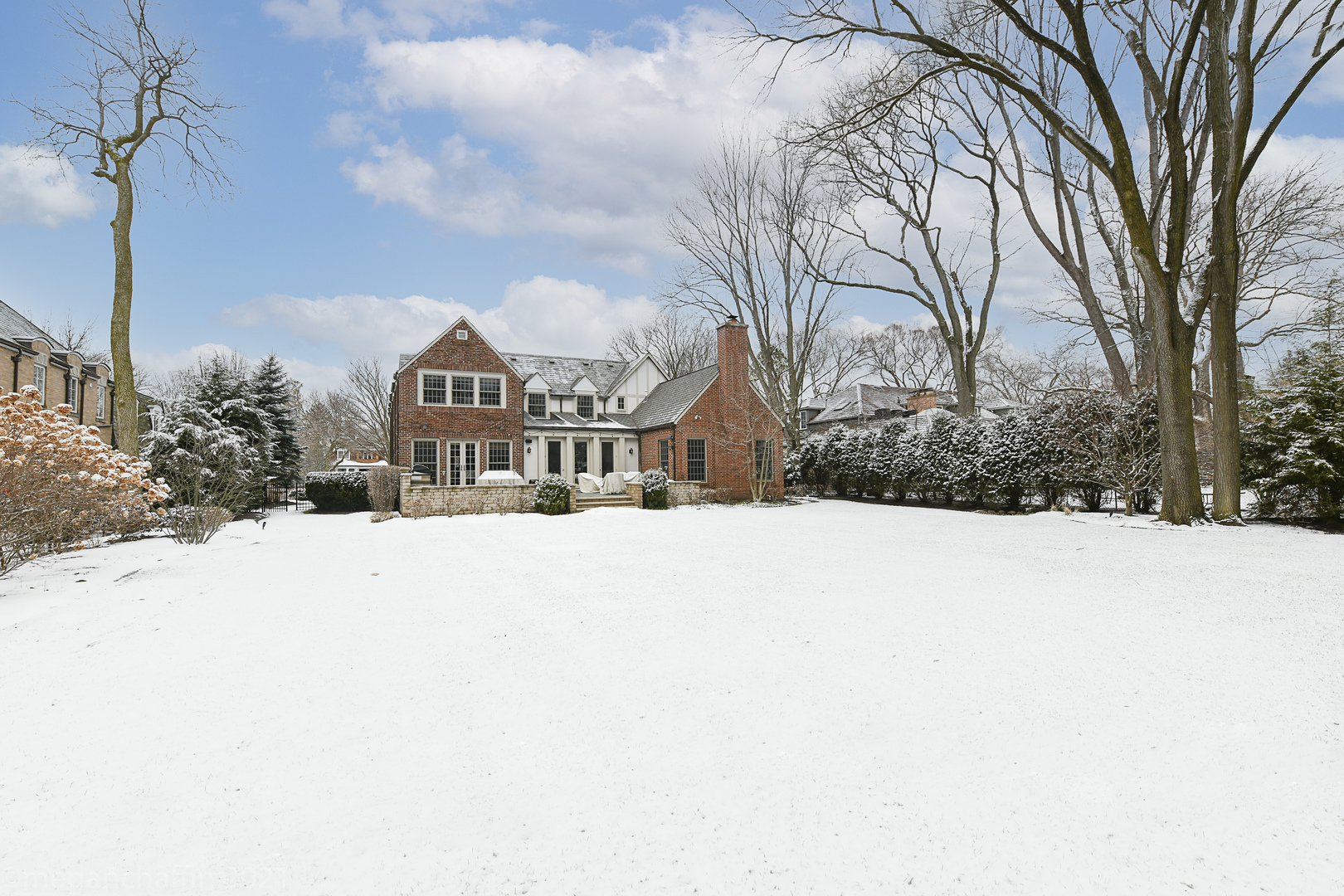 1100 Mohawk Road Wilmette, IL 60091 - Photo 2 of 2 a view of houses with snow on the road