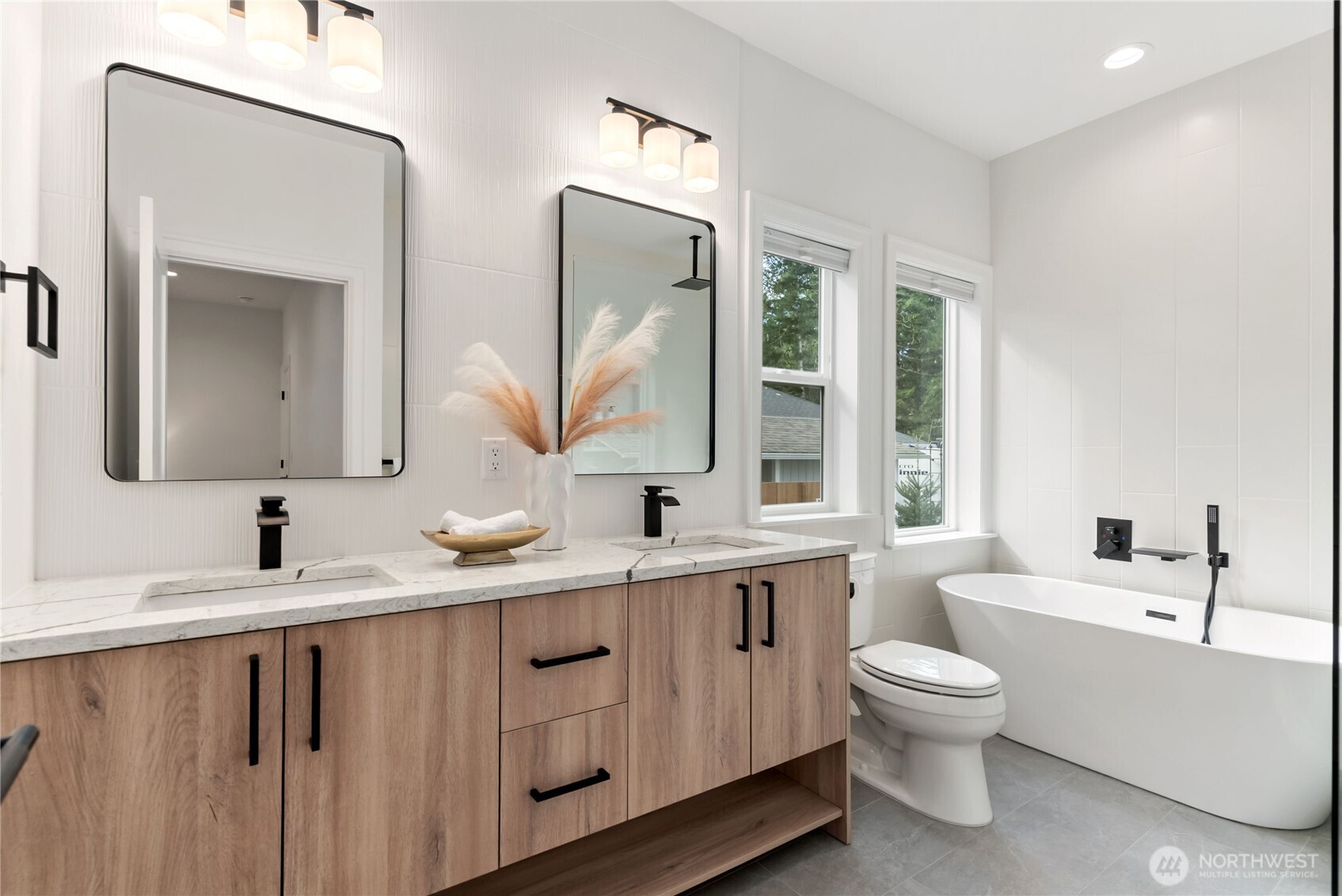 31 East Rhododendron Court Union, WA 98592 - Photo 21 of 38 a bathroom with a toilet sink and mirror