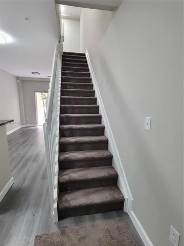 a view of a balcony with bed
