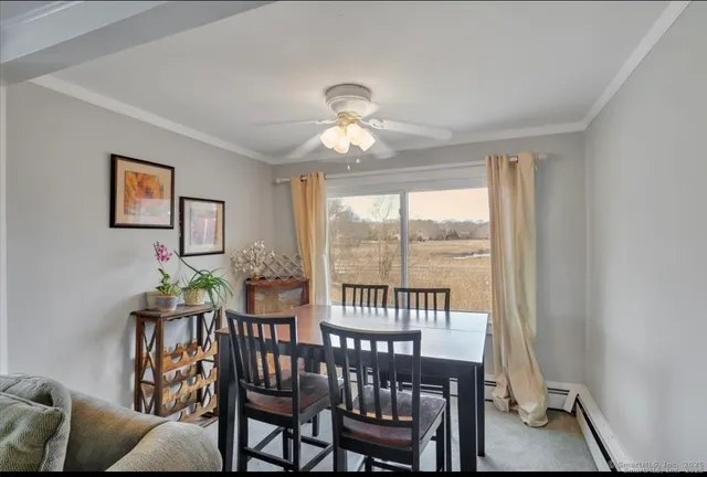 a view of a dining room with furniture window and outside view