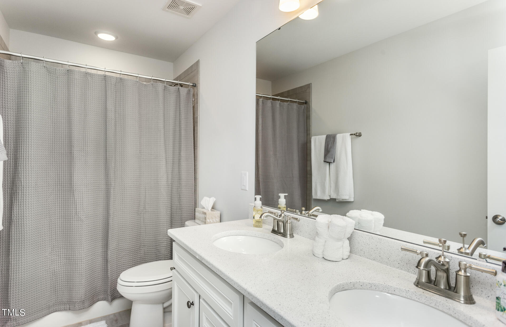 528 Fosterton Cottage Way Raleigh, NC 27603 - Photo 17 of 26 a bathroom with a granite countertop sink toilet and a mirror