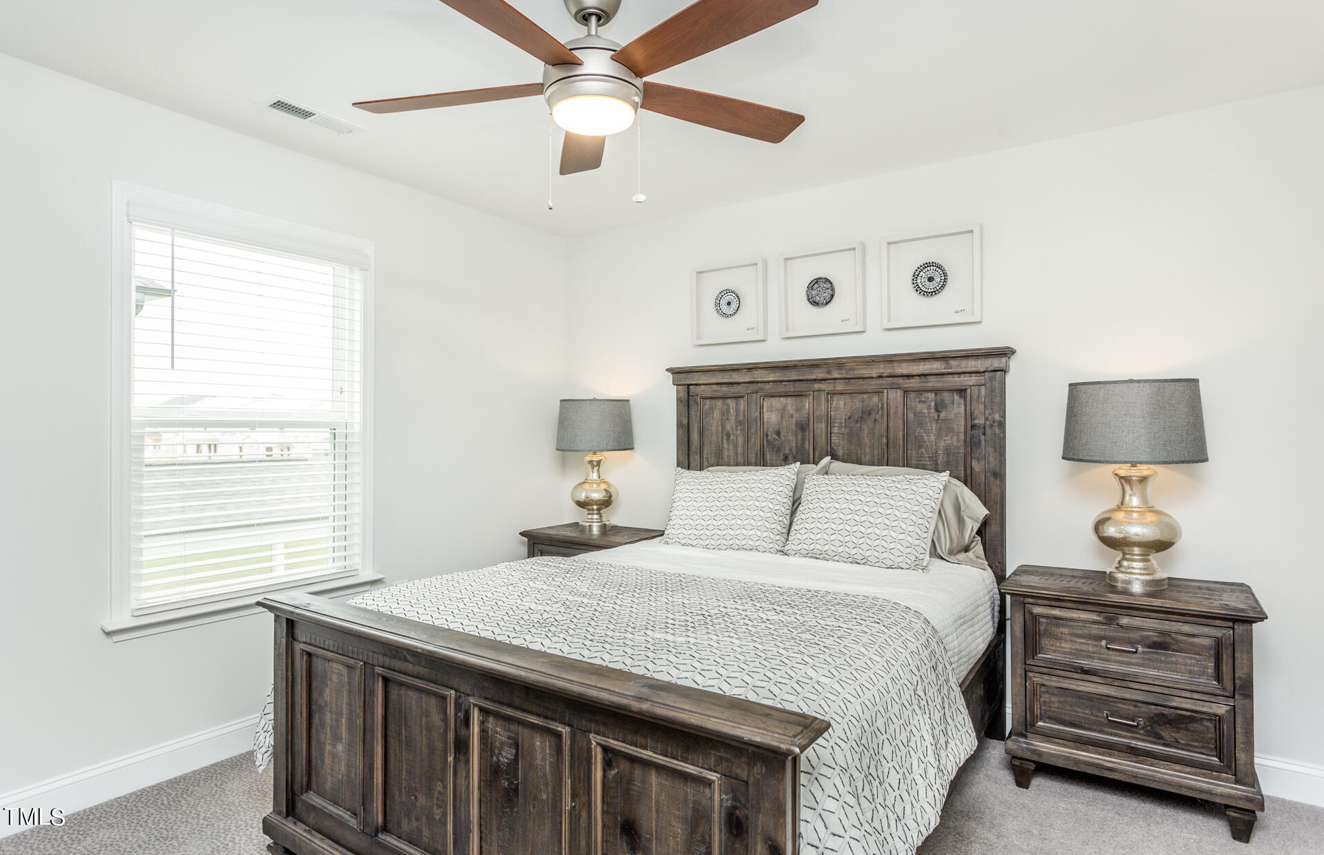 528 Fosterton Cottage Way Raleigh, NC 27603 - Photo 19 of 26 a bedroom with a bed and a lamp on the dresser