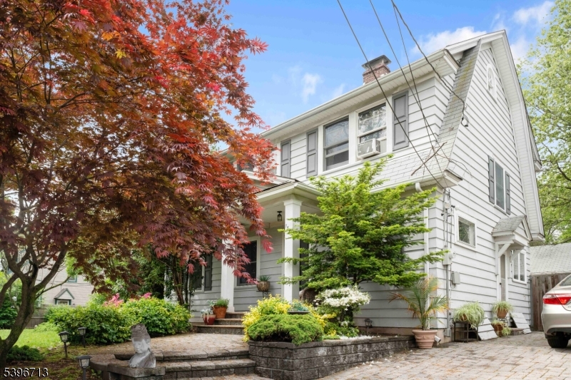 1321 Murray Avenue Plainfield, NJ 07060 - Photo 1 of 13 a front view of a house with plants and trees