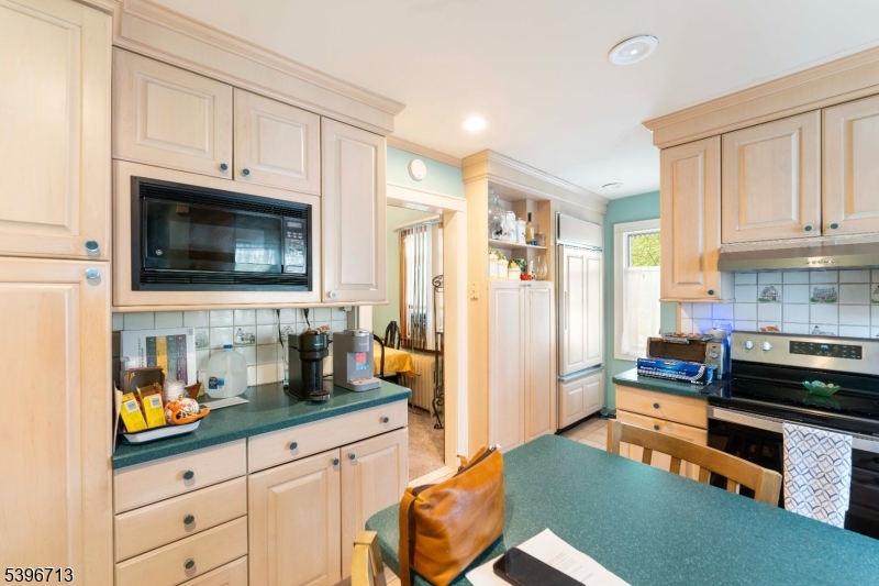 1321 Murray Avenue Plainfield, NJ 07060 - Photo 4 of 13 a kitchen with stainless steel appliances a stove a sink a refrigerator and cabinets