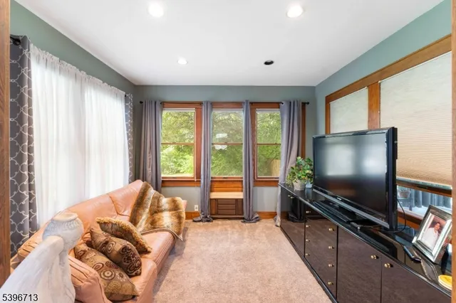 a view of a room with furniture and a potted plant
