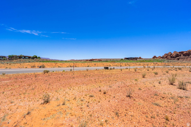 3306 South Endless Trail, Unit 33 Hurricane, UT 84737 - Photo 17 of 27 Expansive desert landscape with a paved road