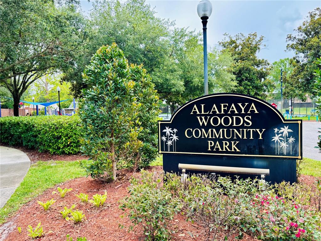 1045 Shaffer Trail Oviedo, FL 32765 - Photo 28 of 30 a sign that is sitting in front of flowers