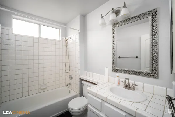 an aerial view of a tennis ground and a lots of palm trees