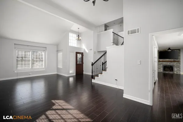 a kitchen with stainless steel appliances a refrigerator sink and cabinets